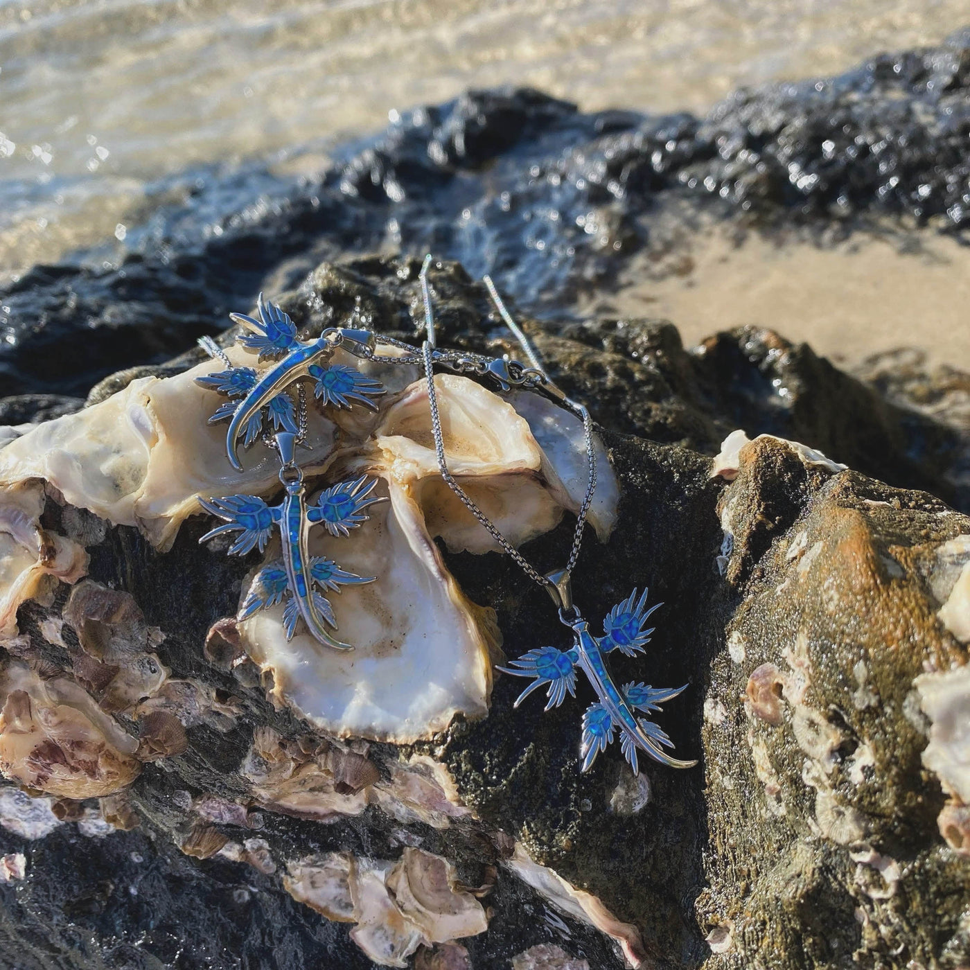Blue Dragon Opal Necklace photographed by the water