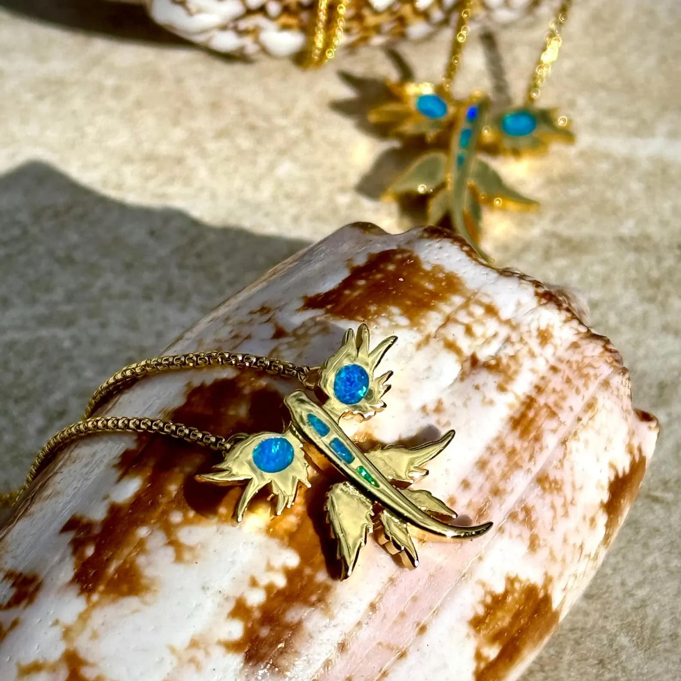 Close detail of the Opal and Gold Dragon Necklace pendant, 15mm across